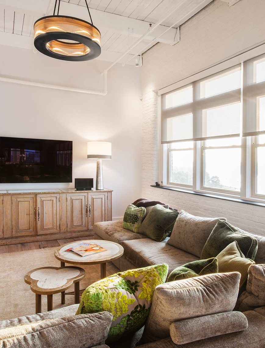 City loft living room with large windows interior design
