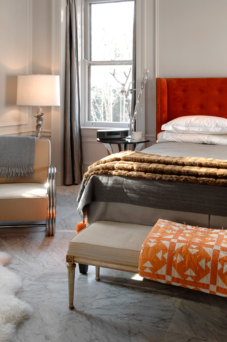 Modern interior design bedroom with orange blanket