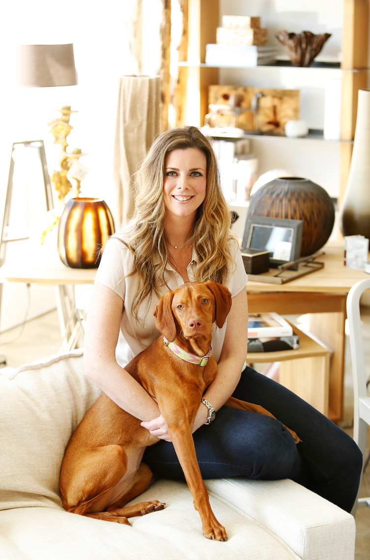 Margit Jacobson interior designer sits for portrait with her dog in Rochester New York