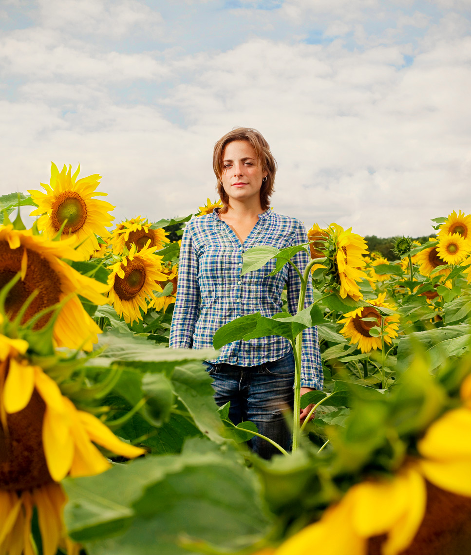 Portrait of female farmer in sunflower field in Rochester New York